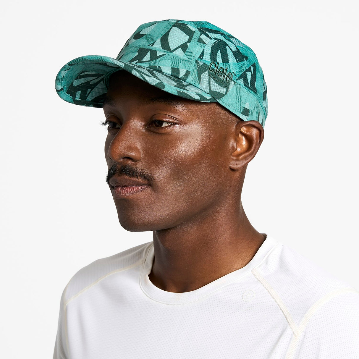 Ciele Athletics GOCap SC Field Loopy MU running hat in Dusty Turquoise worn by a man on a neutral background.