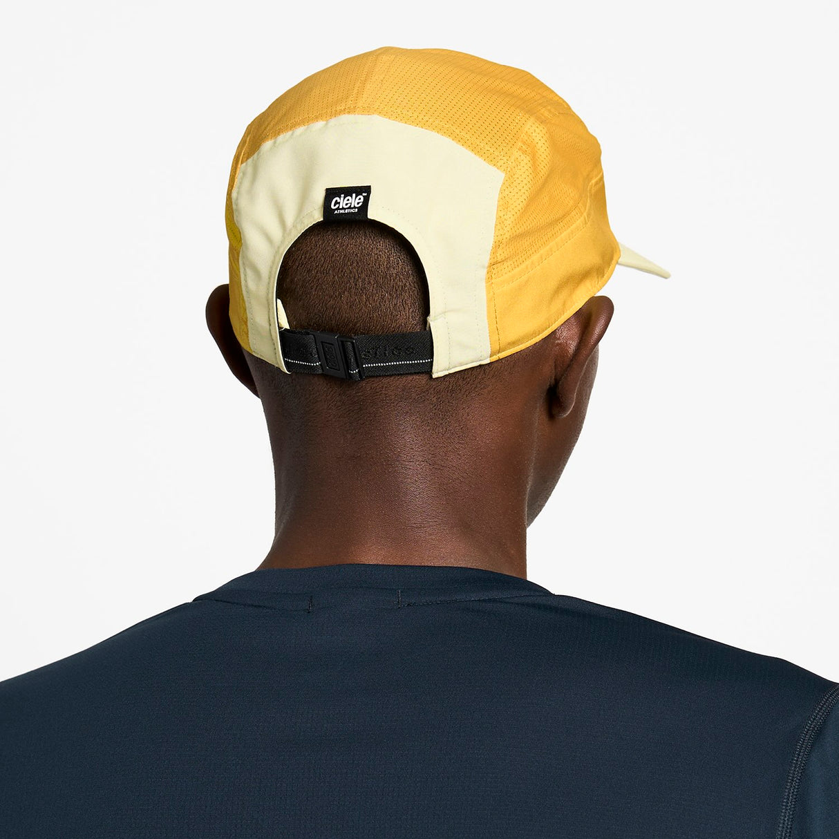 Ciele Athletics GOCap Comp Century running hat in Glade worn by a man on a neutral background.