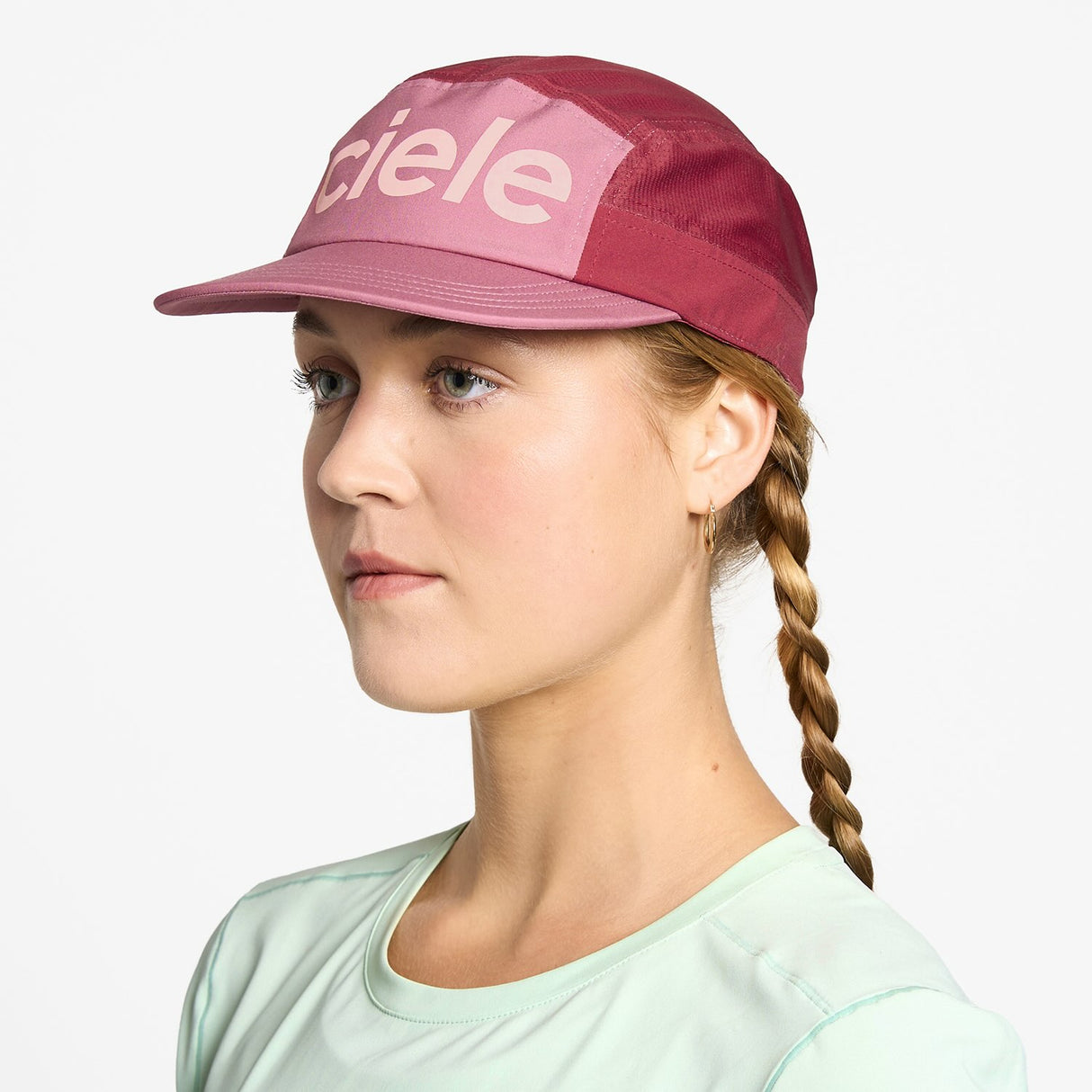 Ciele Athletics GOCap Comp Century running hat in Deco Rose/Merlot worn by a woman on a neutral background.