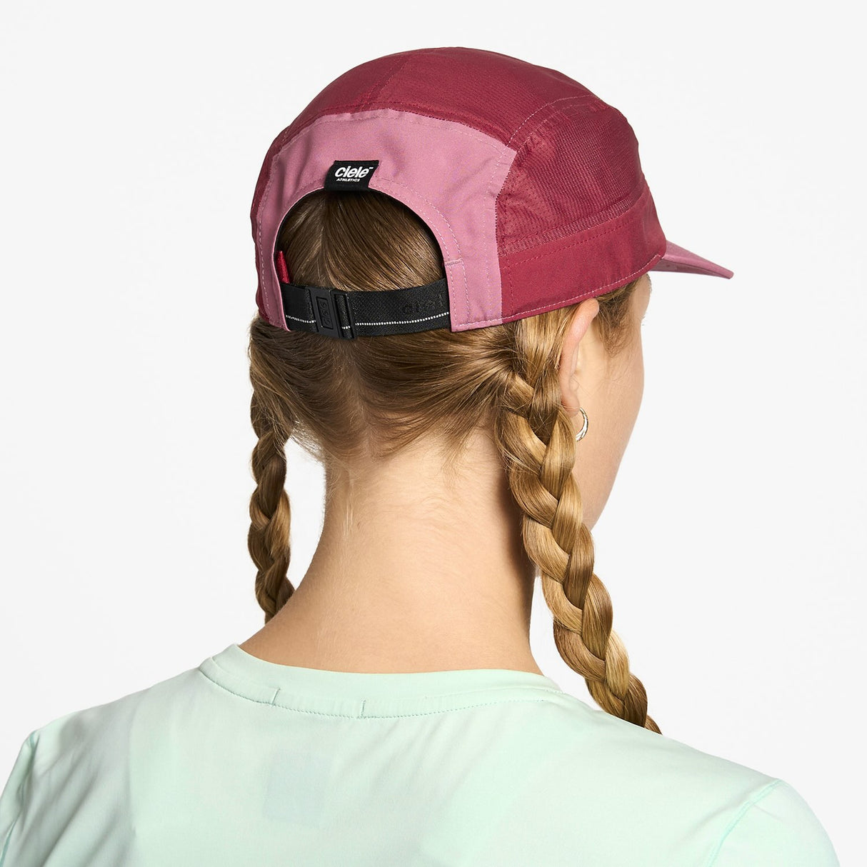 Ciele Athletics GOCap Comp Century running hat in Deco Rose/Merlot worn by a woman on a neutral background.