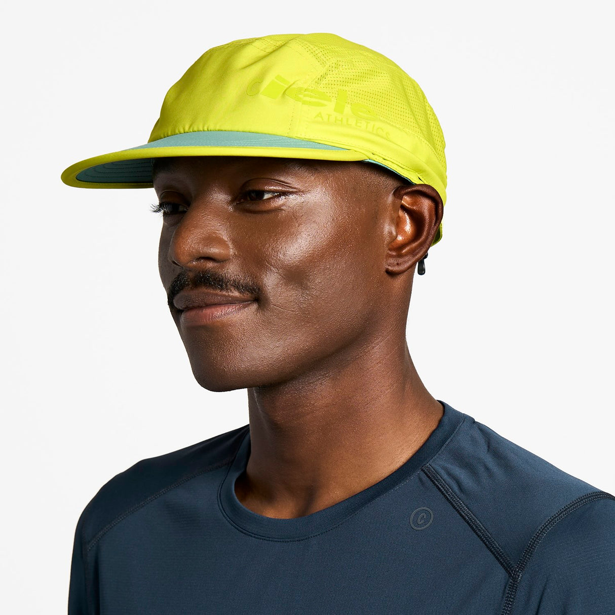 Ciele Athletics GOCap PYN Comp - Onehundred in Lucifer Yellow on a neutral background.