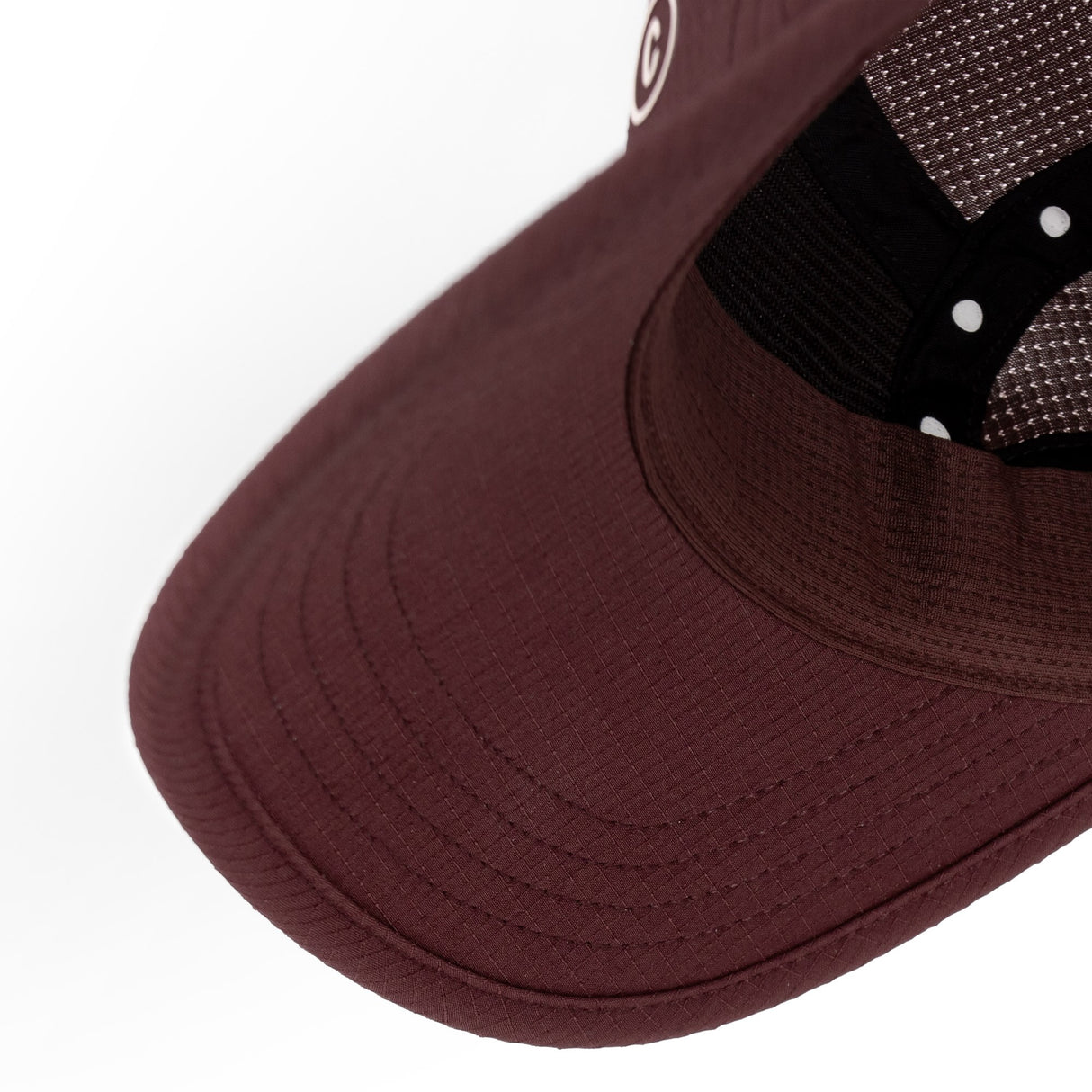 Close-up of a Ciele Athletics GOCap SC Field - Clow Dark Wine Red Maroon running cap on a white background