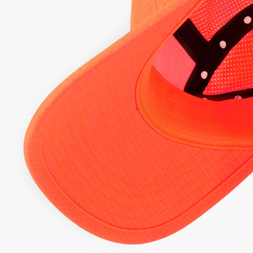 Close-up of an orange GOCap SC Field - Capital RC running hat in Infrared on a white background