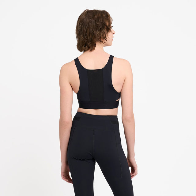 Ciele Athletics W QCKBra women's running bra in Shadowcast worn by a woman on a neutral background.