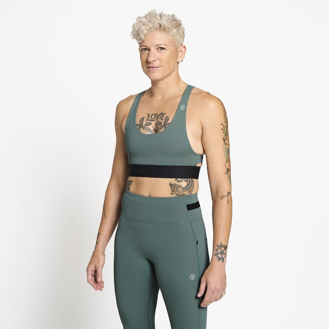 Ciele Athletics W QCKBra women's running bra in Silver Pine worn by a woman on a neutral background.