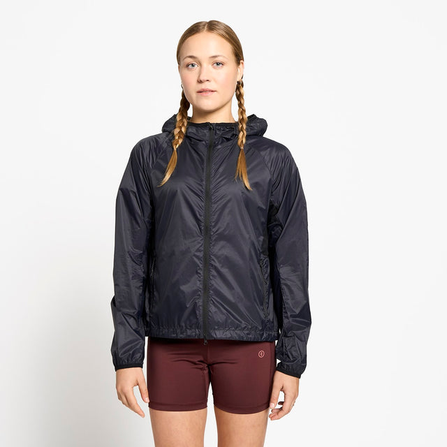 Ciele Athletics W VNTJacket women's running jacket in Shadowcast worn by a woman on a neutral background.