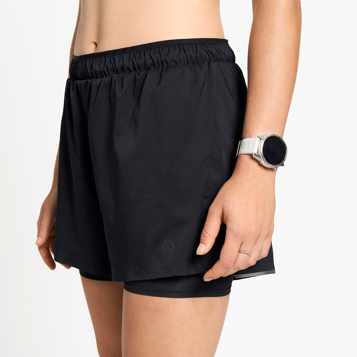 Ciele Athletics W DLYShort 4" Long Brief women's running shorts in Shadowcast worn by a woman on a neutral background.