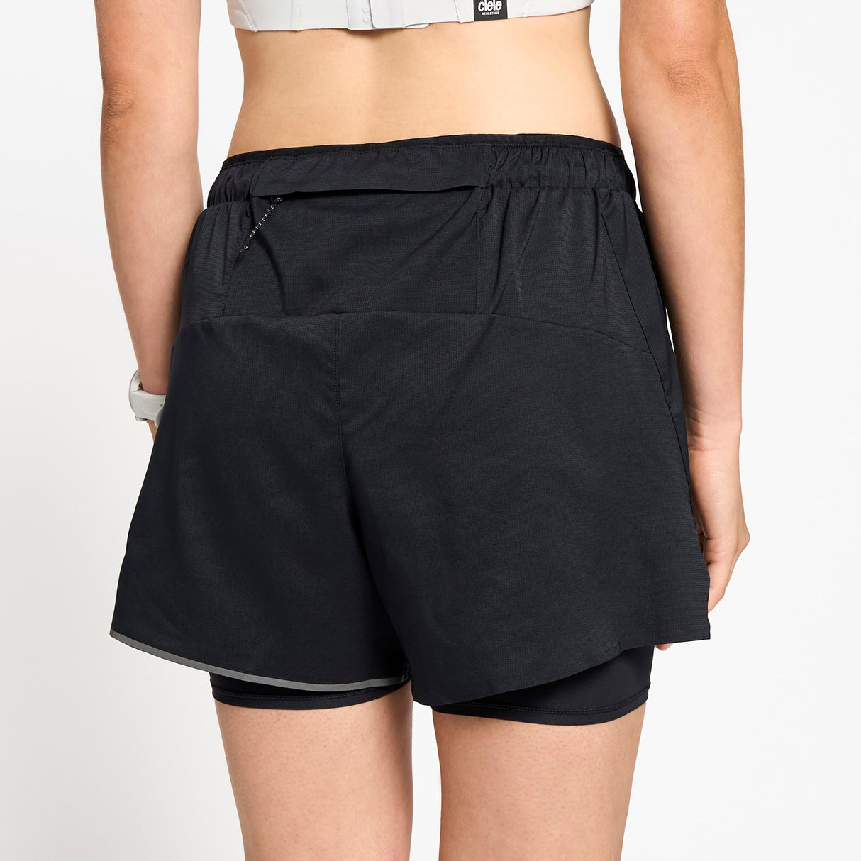 Ciele Athletics W DLYShort 4" Long Brief women's running shorts in Shadowcast worn by a woman on a neutral background.