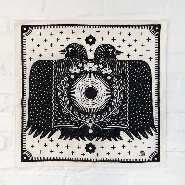 Land & She Folk Bird bandana on a neutral background.