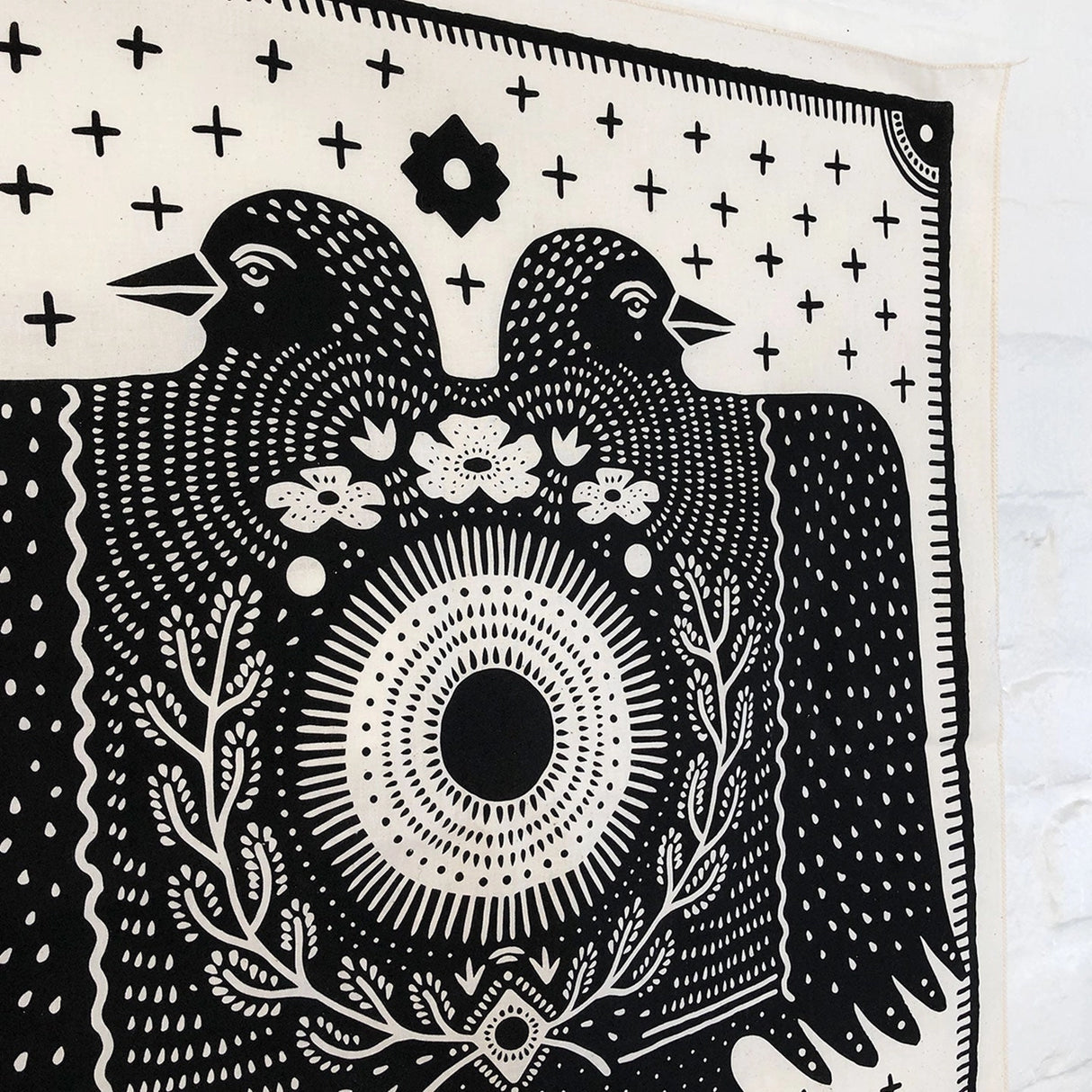 Land & She Folk Bird bandana on a neutral background.