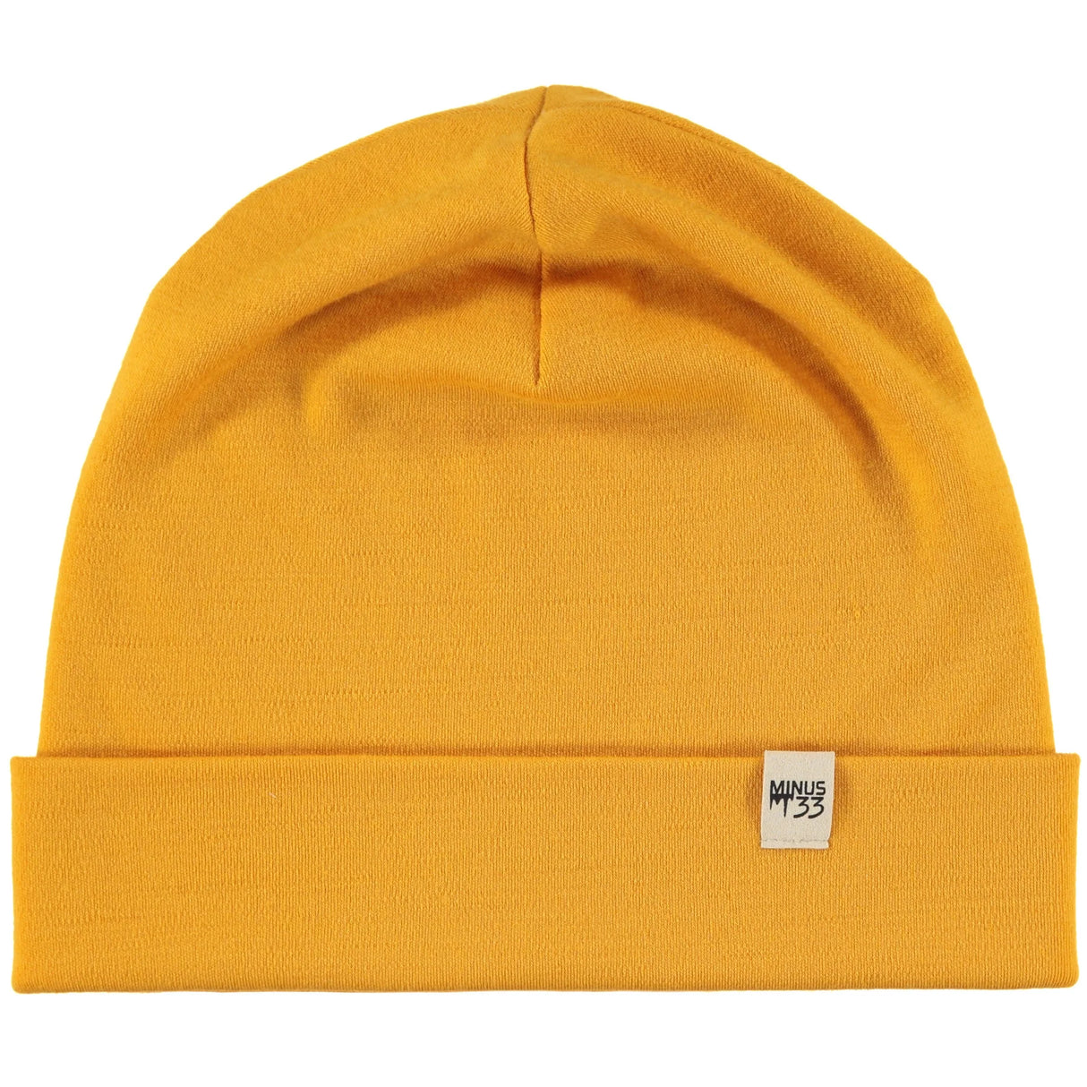 Minus33 Ridge Cuff Merino Wool Beanie in Gold on a neutral background.