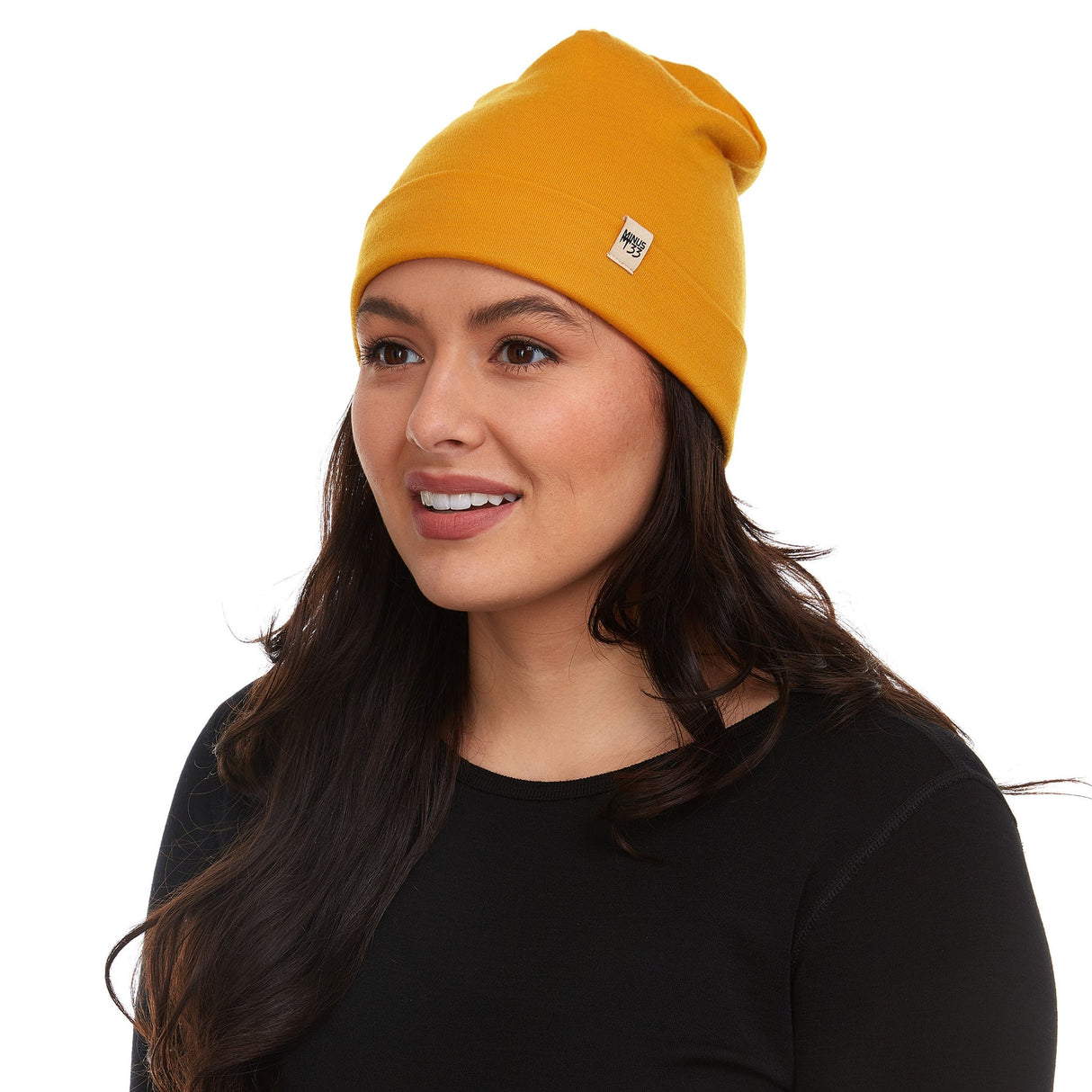 Minus33 Ridge Cuff Merino Wool Beanie in Gold is double layered and features a removable tag.
