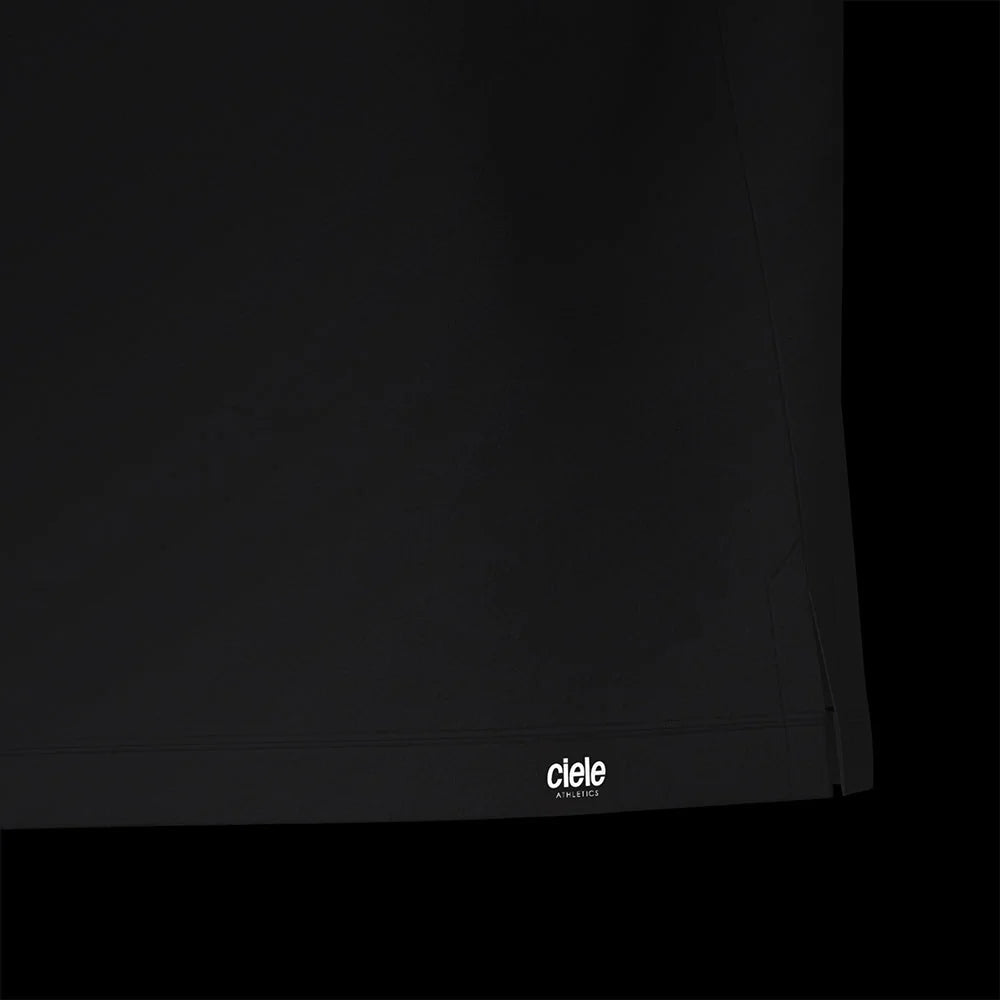 Ciele Athletics M DLYSinglet in Shadowcast from the rear on a dark background.