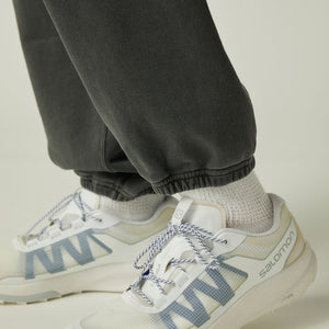 Close-up of Snow Peak Garment Dyed Pants in Charcoal with a neutral background