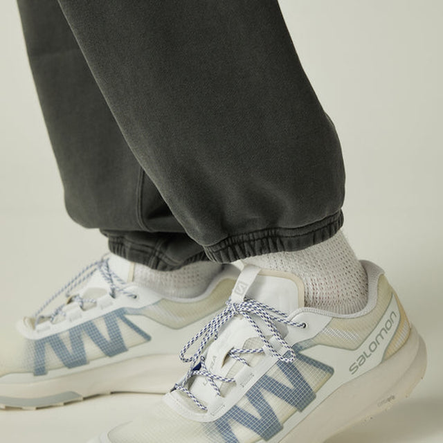 Close-up of Snow Peak Garment Dyed Pants in Charcoal with a neutral background