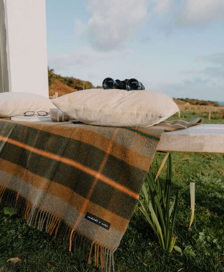 Sackcloth & Ashes Folk Olive camping blanket outdoors.