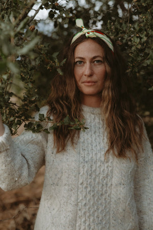 Bandits La Magia De Tochtli Bandana worn by a woman outdoors.