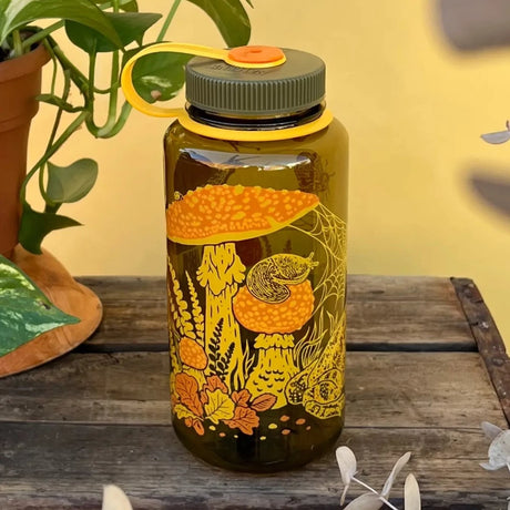 Mustard Beetle 32oz Nalgene bottle with the Toad & Mushrooms print features an orange and yellow print on a brown Nalgene bottle.