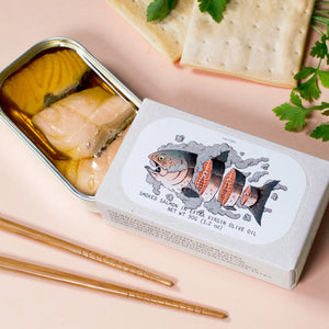 Jose Gourmet Smoked Salmon in Extra Virgin Olive Oil on a pink background