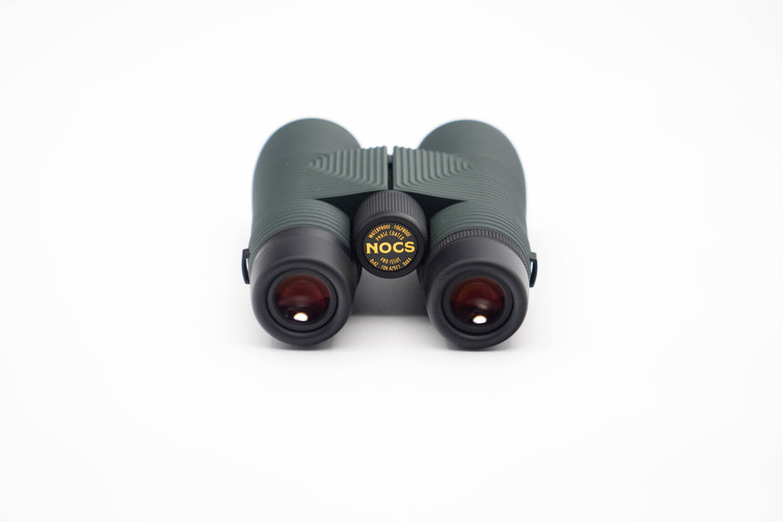 Nocs Provisions Pro Issue 8X Waterproof Binoculars in Alpine Green on a neutral background.