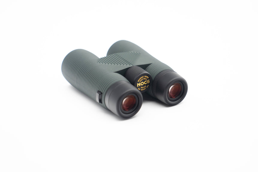 Nocs Provisions Pro Issue 8X Waterproof Binoculars in Alpine Green on a neutral background at an angle.