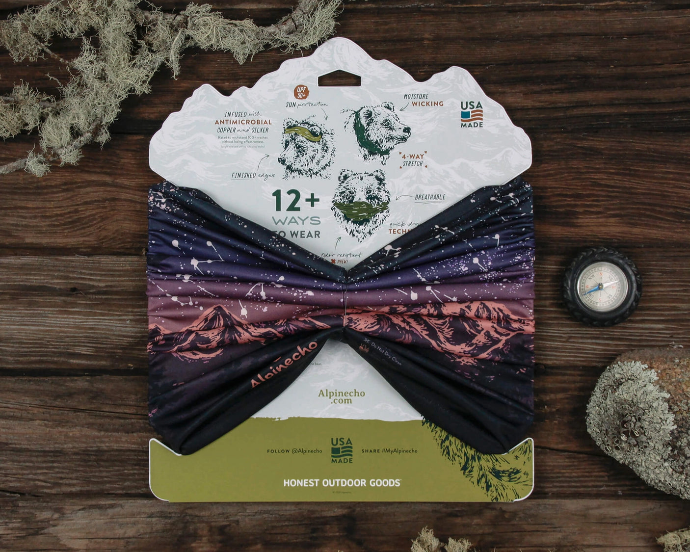 Alpinecho's Stargazer Neck Gaiter in Plum packaged on a dark wood background.