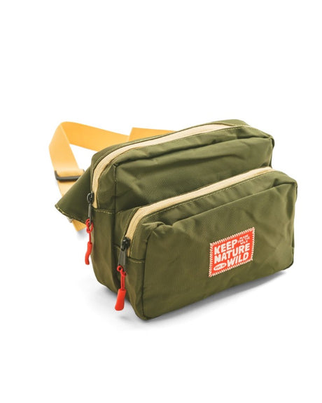 Keep Nature Wild adventure fanny pack in olive green with a stitched on Keep Nature Wild logo patch on the front.