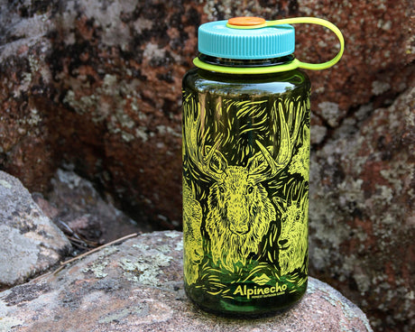 Wrap around woodcut wildlife design from Alpinecho, with many iconic North American animals, including a moose, bison, river otter, mountain goat, fox, bear, great horned owl, and pika.