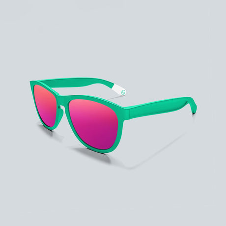 Cape Clasp recycled plastic sunglasses in a sea foam green with pink polarized lenses.