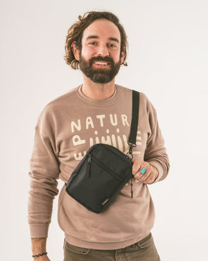 Keep Nature Wild crossbody bag is made from recycled nylon.