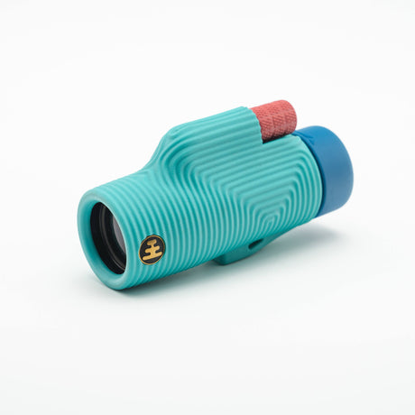Nocs Provisions Zoom Tube 8x32 Monocular in Tahitian Blue on a neutral background.