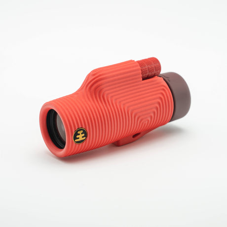 Nocs Provisions Zoom Tube 8x32 Monocular in Cardinal Red on a neutral background.