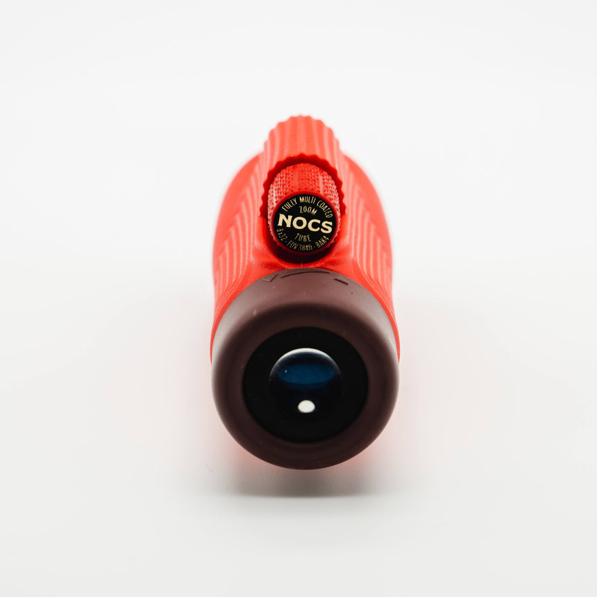 Nocs Provisions Zoom Tube 8x32 Monocular in Cardinal Red on a neutral background showing the eye piece.