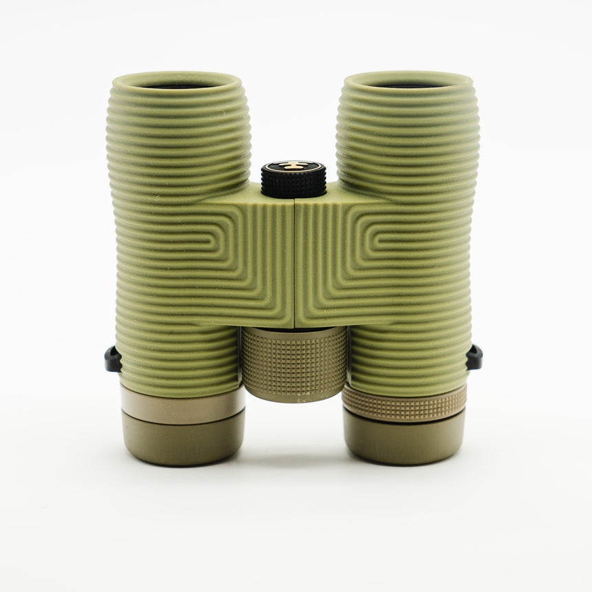 Nocs Provisions Field Issue 10X Waterproof Binoculars in Ponderosa Green on a neutral background from above.