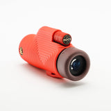 Nocs Provisions Zoom Tube 8x32 Monocular in Cardinal Red on a neutral background at an angle.