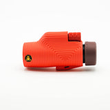 Nocs Provisions Zoom Tube 8x32 Monocular in Cardinal Red on a neutral background from the side.