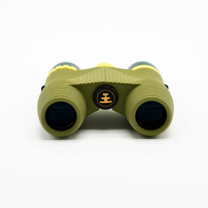 Nocs Standard Issue 10x25 Waterproof Binoculars in olive green showing the lenses on a neutral background.