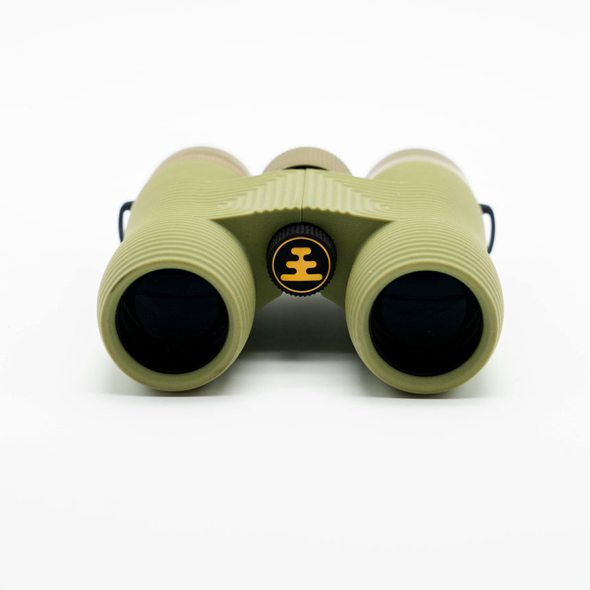 Nocs Provisions Field Issue 10X Waterproof Binoculars in Ponderosa Green on a neutral background showing the end lenses.