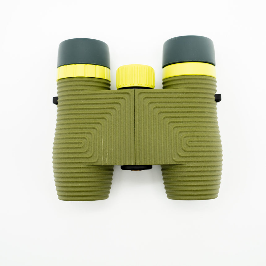 Nocs Standard Issue 10x25 Waterproof Binoculars in olive green from above on a neutral background.