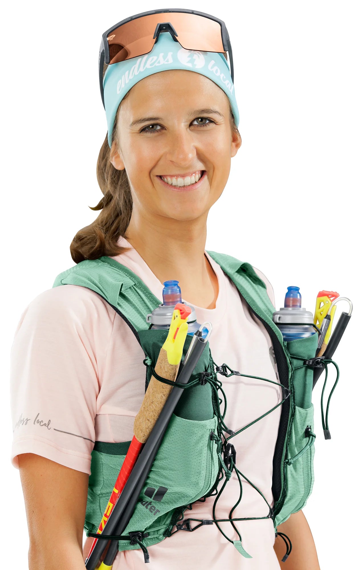 deuter Traick 5 SL running hydration vest in Spearmint-Seagreen worn by a woman on a neutral background.