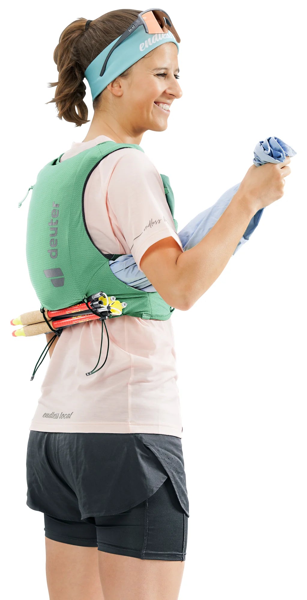 deuter Traick 5 SL running hydration vest in Spearmint-Seagreen worn by a woman on a neutral background.