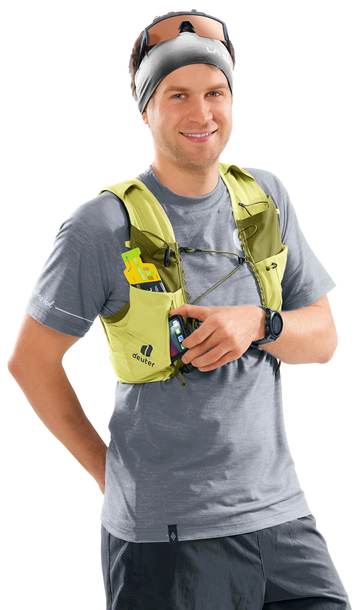 deuter Traick 5 running hydration vest in Sprout-Cactus worn by a man on a neutral background.