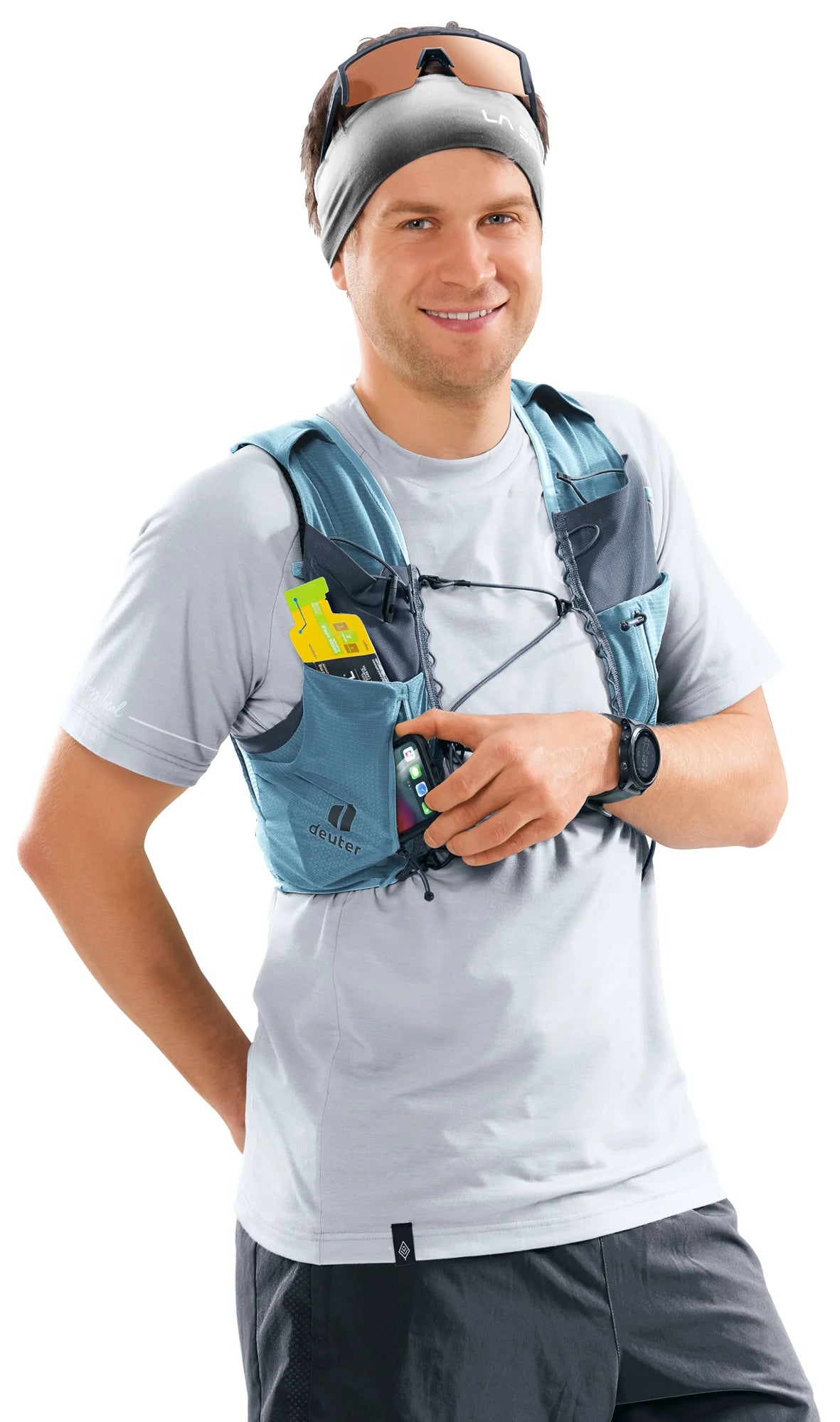 deuter Traick 5 running hydration vest in Atlantic-Ink worn by a man on a neutral background.