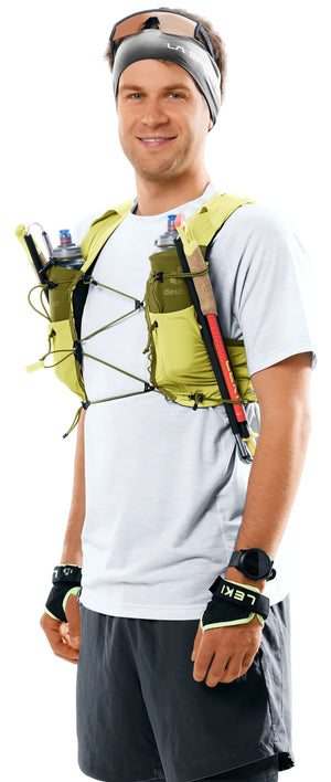 deuter Traick 9 running hydration vest in Sprout-Cactus worn by a man on a neutral background.