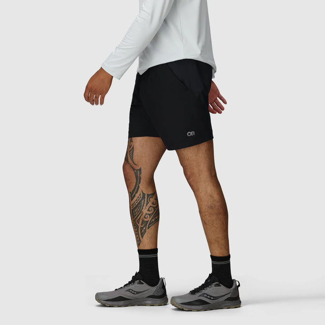 Person wearing Outdoor Research Men's Swift Lite Hybrid Shorts 7" in Black on a white background