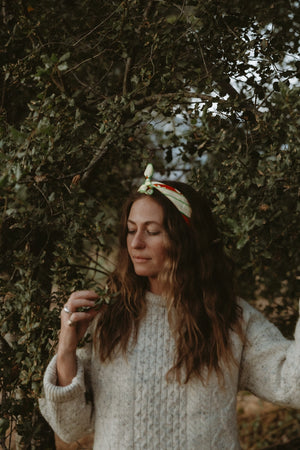 Bandits La Magia De Tochtli Bandana worn by a woman outdoors.