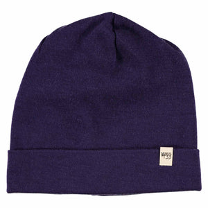 Minus33 Ridge Cuff Merino Wool Beanie in Dark Purple on a neutral background.