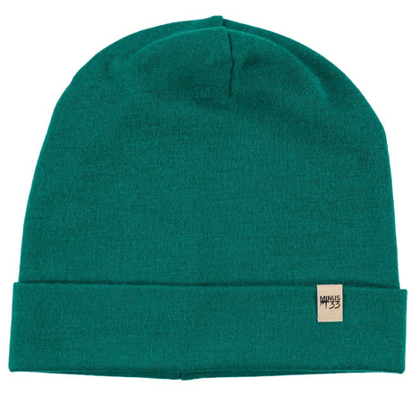 Minus33 Ridge Cuff Merino Wool Beanie in Emerald Green on a neutral background.