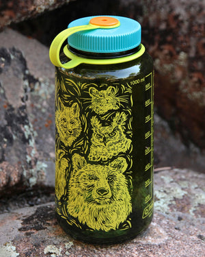 Wrap around woodcut wildlife design from Alpinecho, with many iconic North American animals, including a moose, bison, river otter, mountain goat, fox, bear, great horned owl, and pika.