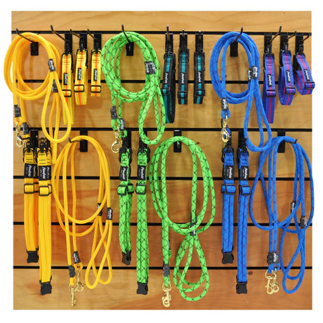 Flowfold Recycled Climbing Rope Dog Leash made in the USA on a pegboard with other dog leashes and collars.